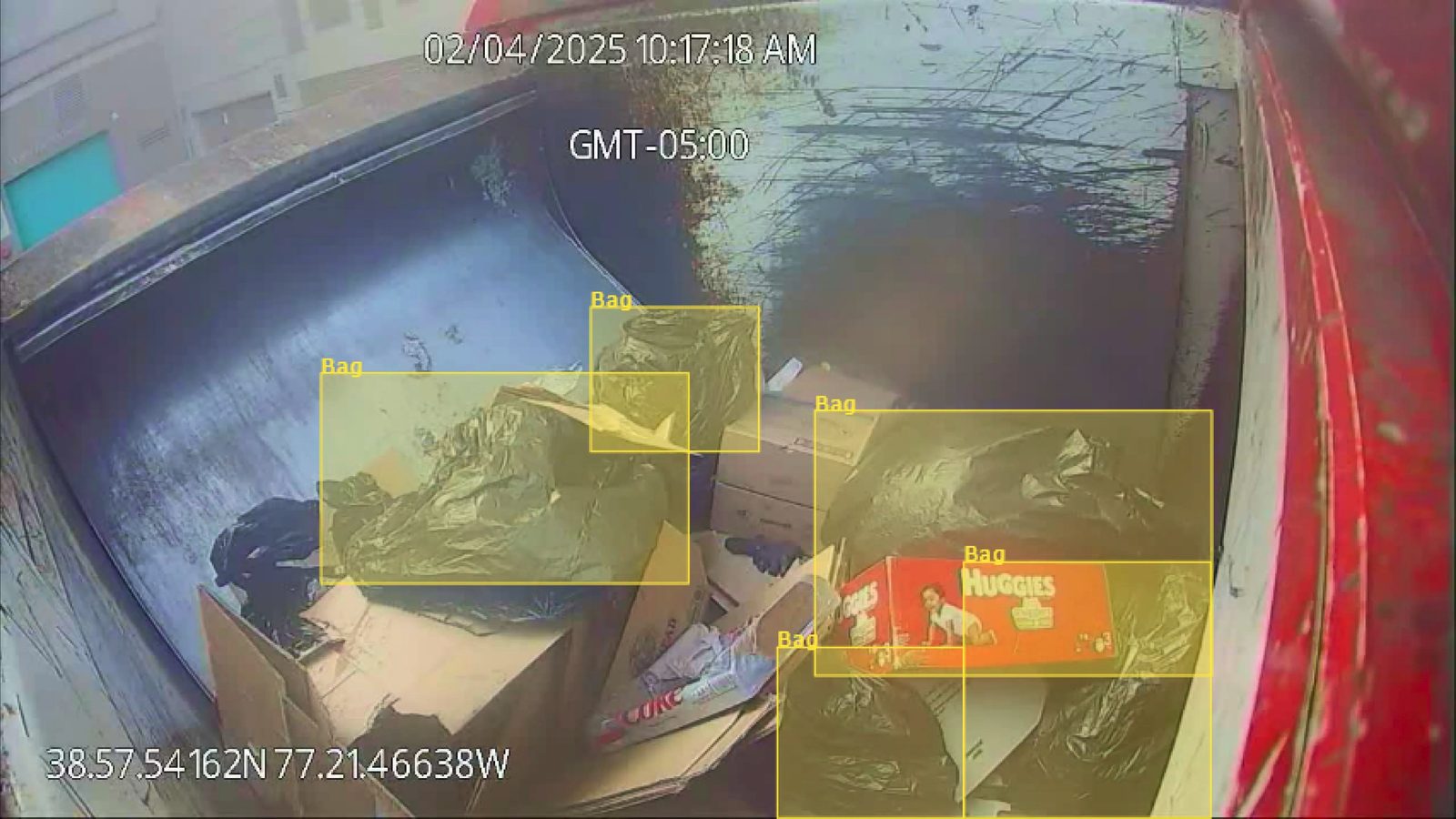 WasteVision AI detecting plastic bag contamination with bounding box overlays inside a truck hopper